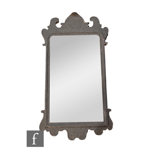 476 - A 20th Century George I style gilt carved wall mirror, later grey painted, the bevelled glass plate ... 