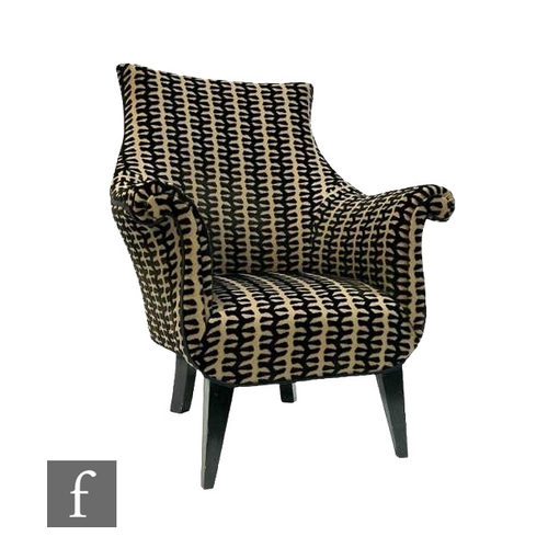 489 - An early 20th Century French armchair, the swept back falling to roll arms above a cushion seat with... 