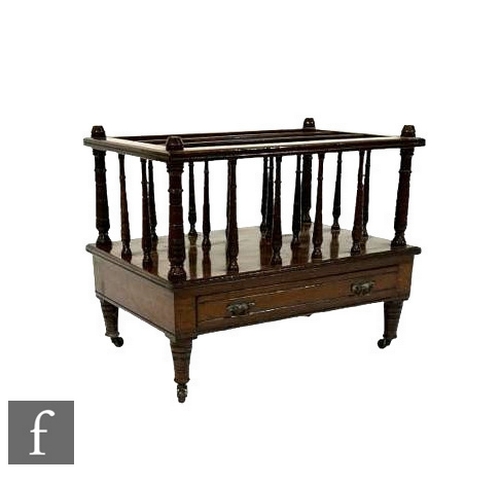 492 - A late Victorian mahogany canterbury, three divisions with turned supports over a base drawer, on tu... 