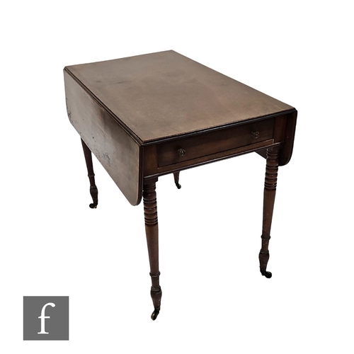 500 - A mid 19th Century mahogany drop flap Pembroke table, single end drawer, on ring turned legs and bra... 