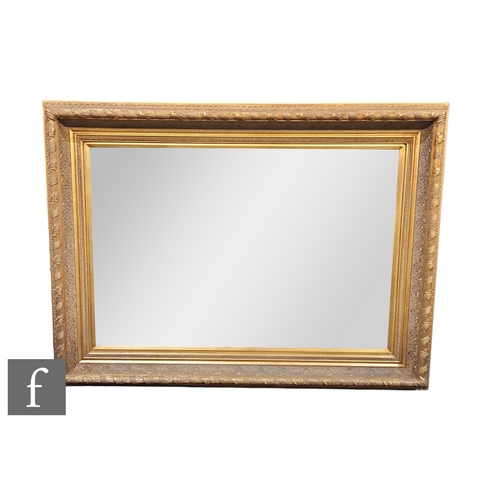 507 - A 20th Century gilt rectangular wall mirror, 96cm x 115cm.