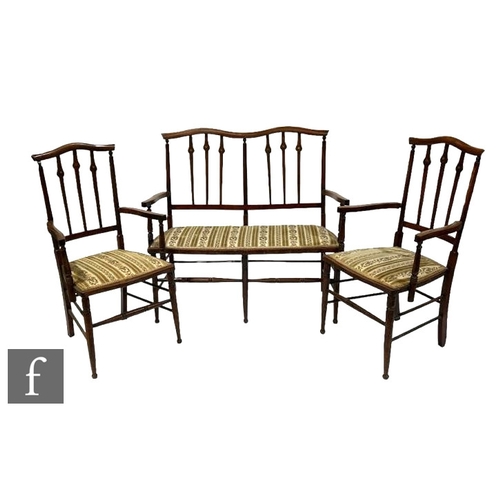 525 - An Edwardian beech framed three-piece salon suite, comprising a two seat settee and two open armchai... 