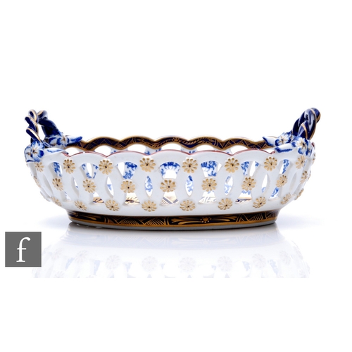 80 - A 19th Century Royal Worcester oval sweet meat dish, formed as a basket with pierced sides and twist... 