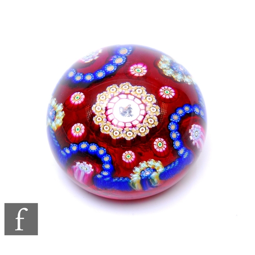 863 - A later 20th Century Perthshire glass paperweight of domed form, internally decorated with a central... 