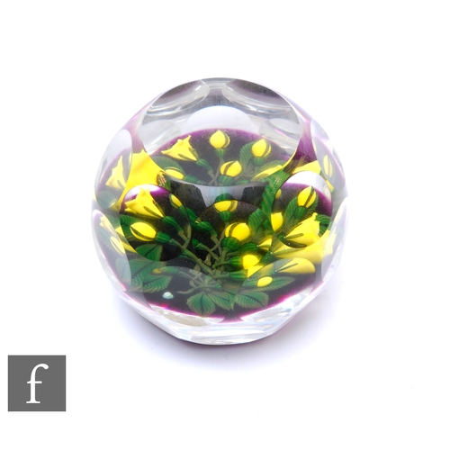 867 - A contemporary Perthshire glass paperweight, internally decorated with a bouquet of stylised lampwor... 