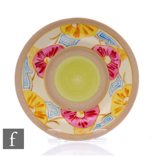 161 - A Clarice Cliff circular side plate hand painted in the Hollyrose pattern with a border of stylised ... 