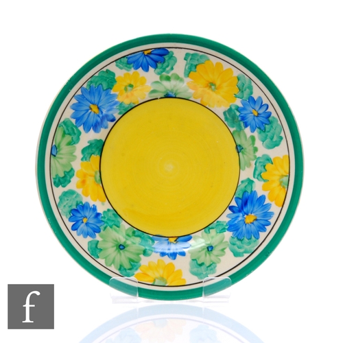 162 - A Clarice Cliff circular side plate circa 1939, hand painted in the Sun Gay pattern with a stylised ... 