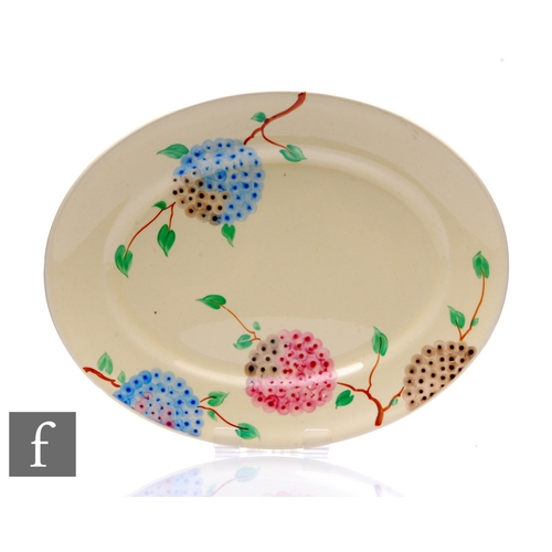 165 - A Clarice Cliff oval meat plate circa 1935, hand painted in the Lilac pattern with stylised flowerin... 