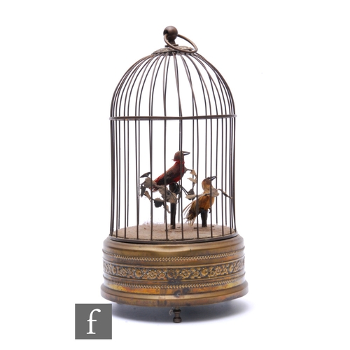 206 - An early 20th Century Griesbaum two singing birds in a brass cage, both birds move and sing, height ... 