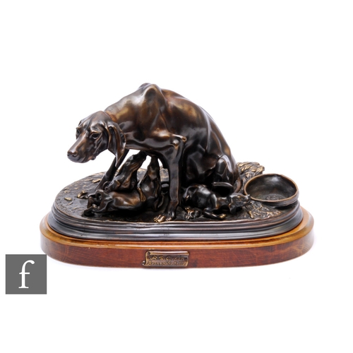 213 - A 20th Century bronze study after P J Mene, depicting a hound feeding her pups, on stepped oval base... 