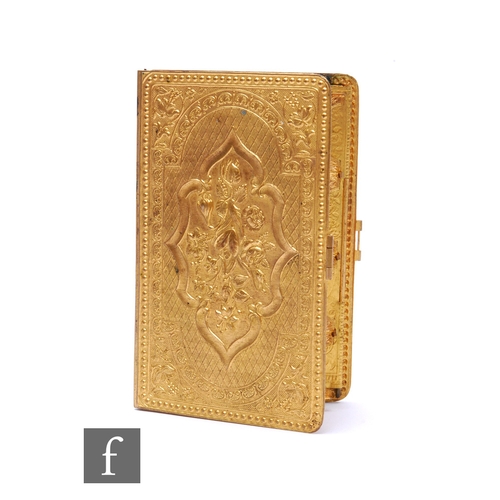 216 - A Victorian gilt needle case in the form of a book, interior containing two four divisioned slots fo... 