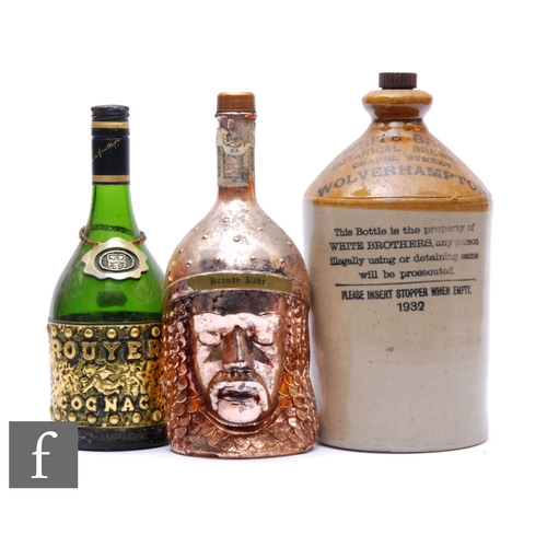 256 - A full figural brandy Kabe bottle of a Knight and his lady, an empty bottle of Rouyer Cognac and a t... 