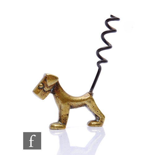 270 - A 1930s Art Deco brass bottle opener in the form of a stylised terrier with a corkscrew tail.