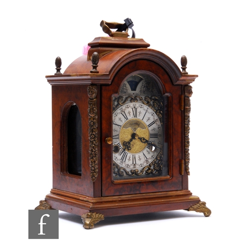 296 - A small 18th Century style walnut cased bracket clock by Wuba, silvered arch dial with moonphase and... 