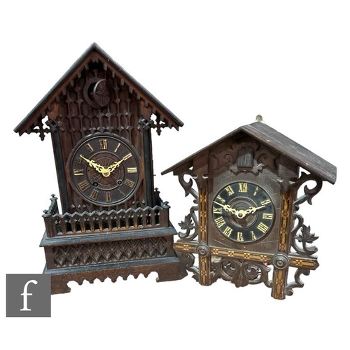 308 - A late 19th Century carved walnut cased cuckoo clock of architectural form, on a plinth base, height... 