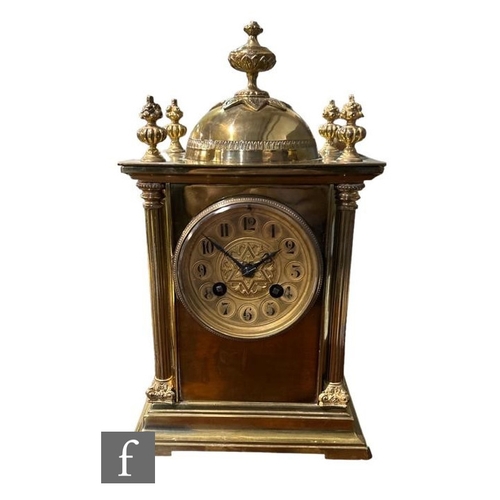 310 - An early 20th Century brass mantle clock, eight day striking movement on a gong with Arabic dial bel... 