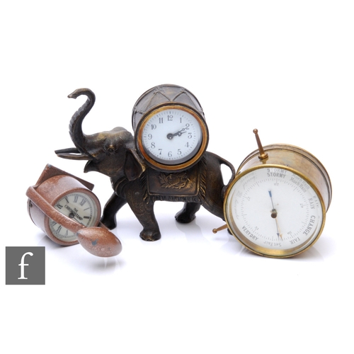 320 - A small early 20th Century bronzed clock in the form of a trumpeting elephant, the movement housed i... 