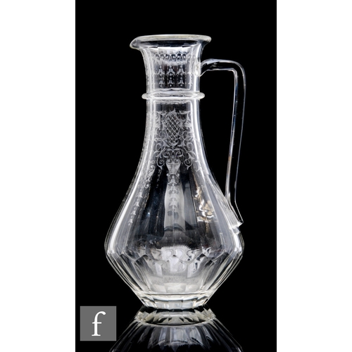 783 - An early 20th Century Lobmeyr clear crystal water jug of low shouldered form with upper collar, inte... 