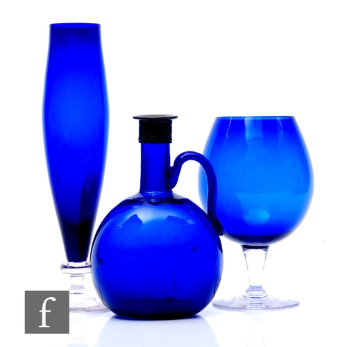 806 - A 19th Century Bristol blue flagon, circa 1850, of compressed globe form with applied handle, 20cm, ... 