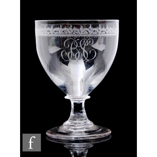 812 - A late 18th Century glass rummer circa 1790, the cup form bowl engraved with a monogram below a styl... 