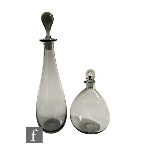 816 - A 1950s Danish glass decanter of skittle form, in smoke grey with conforming stopper, height 40cm, t... 