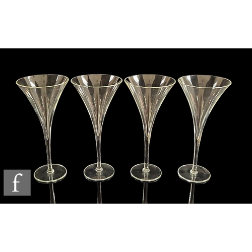 817 - A set of four 19th Century Dutch toasting glasses, each with a funnel bowl extending into the slende... 