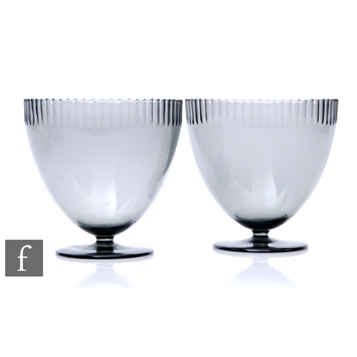 820 - A pair of 1930s Orrefors pedestal bowls designed by Simon Gate, each of ovoid form with a hand cut s... 