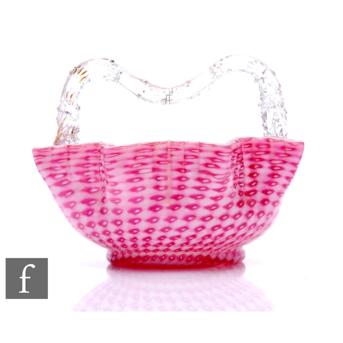 610 - A large late 19th Century Stourbridge glass basket, the footed circular bowl rising to a zigzag fril... 