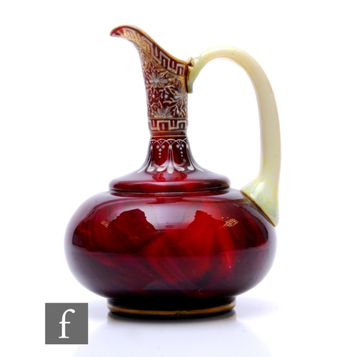 594 - A late 19th Century Loetz Carneol ewer of compressed globe and shaft form with pulled high spout and... 