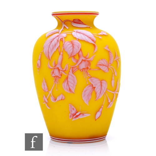 A large 19th Century Thomas Webb & Sons three colour cameo glass vase of shouldered ovoid form with an everted collar neck, the body cased in opal over ruby over citron and cut with a flowering fuchsia bough with butterflies and to the reverse leafy boughs with further butterflies all between banded borders, unmarked, height 25.5cm.