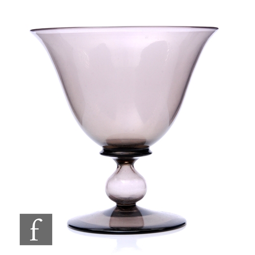 773 - A mid 20th Century Italian Murano glass pedestal bowl, the ovoid bowl with everted rim in a pale smo... 