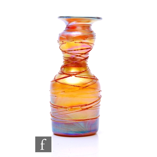 708 - An early 20th Century Louis Comfort Tiffany Favrille glass vase of shouldered cylindrical form with ... 