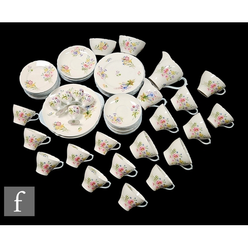 130 - A collection of Shelley 'Wild Flowers' pattern wares, to include a breakfast set and a teaset, tease... 