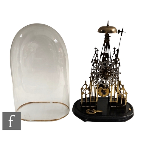 305 - A 19th Century brass cathedral skeleton clock, single fusee movement striking on a bell, in a glass ... 