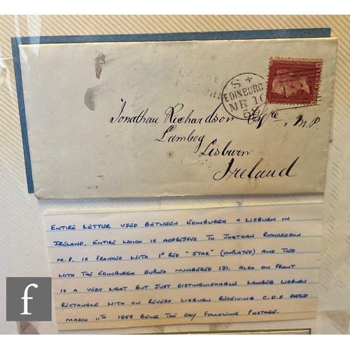 348 - A blue album containing a collection of 19th Century postal covers, postal entries including pre-sta... 