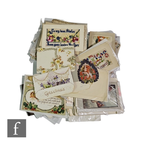 343 - A collection of Victorian Christmas and silk postcards, some military and facsimile examples includi... 