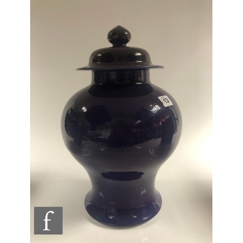 13 - A Chinese late Qing Dynasty Kangxi style monochrome 'Aubergine' glazed baluster jar and cover, with ... 