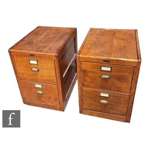 531A - A near pair of 1930s oak four drawer filing cabinets, conforming panel ends, brass handles, height 1... 