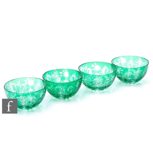 927 - A set of four early 20th Century Stevens and Williams finger bowls, cased in green over clear and fl... 