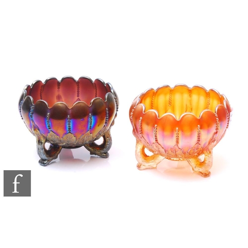 936 - Two early 20th Century Carnival glass three footed bowls by Northwood, each with deep body and wave ... 