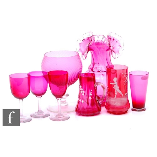 948 - A collection of 19th Century and later ruby glass to include a large frill rim vase, wrythen goblet,... 