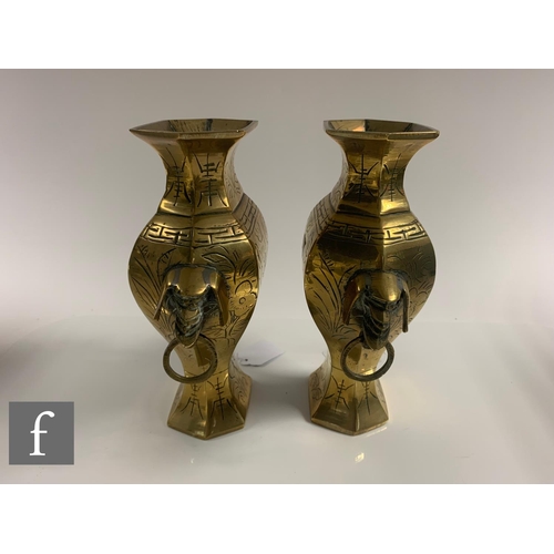 12 - A collection of late Qing Dynasty metalwares, to include a pair of vases with taotie mask handles, h... 