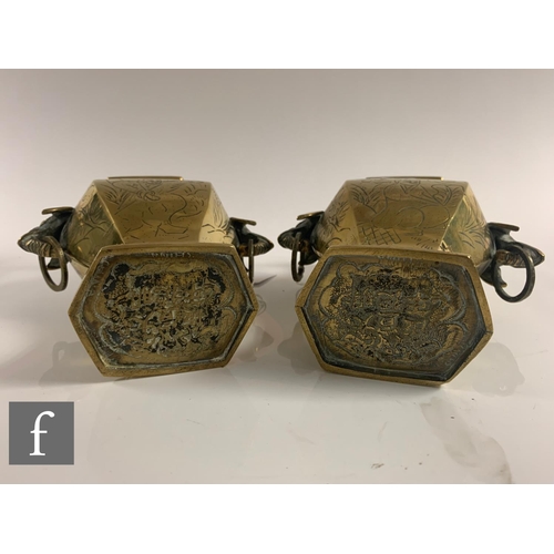 12 - A collection of late Qing Dynasty metalwares, to include a pair of vases with taotie mask handles, h... 