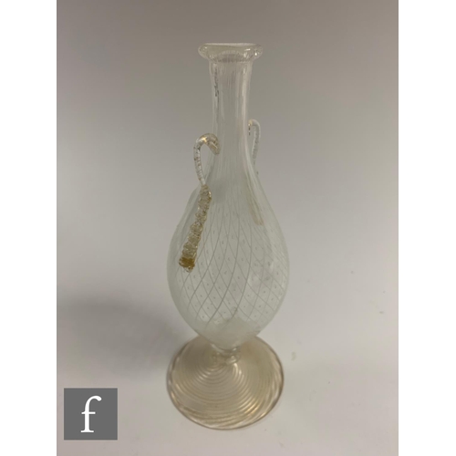 758 - An early 20th Century Italian Murano glass vase in the manner of Salviati & So, the slender foot... 