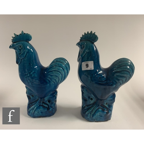 9 - Two late Qing Dynasty Chinese Sancai glazed cockerels, each moulded and raised on rocky outcrop base... 