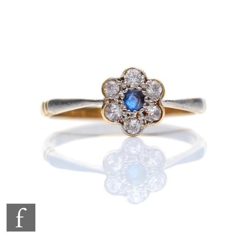 62 - An early 20th Century sapphire and diamond seven stone daisy cluster ring, central sapphire within a... 