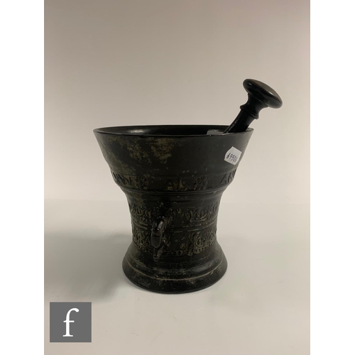 203 - A small continental bronze pestle and mortar with bands of decoration with 'LOF GODT VAN AL 1662', d... 