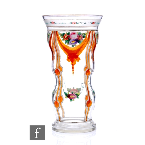 781 - An early 20th Century Bohemian pedestal goblet circa 1920, hand enamelled with floral cartouche pane... 