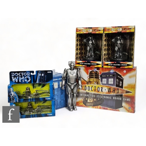 74 - A collection of Doctor Who related items, to include The Interactive Board Game, two diecast collect... 