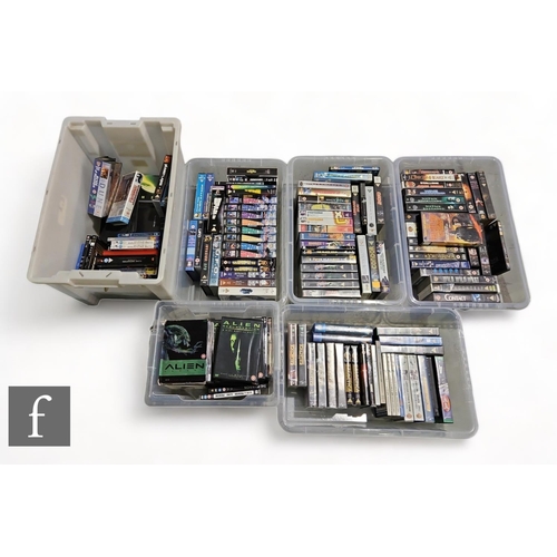 59 - A large collection of assorted Sci-Fi and Action VHS tapes and DVDs, to include Alien, Space 1999, H... 